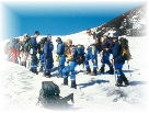 hikers making the climb to see the creater in the volcano villarrica